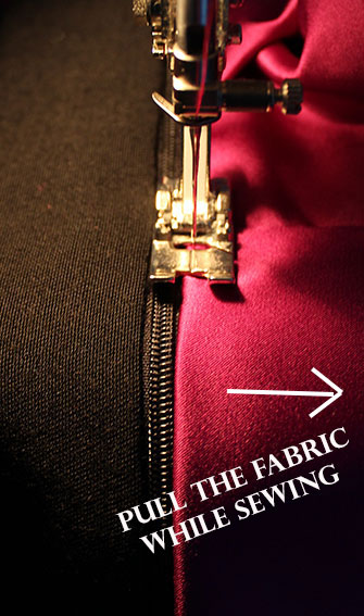 stitching the edge of the zipper