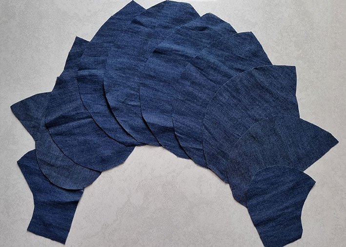 The panel sleeve pieces cut in denim.