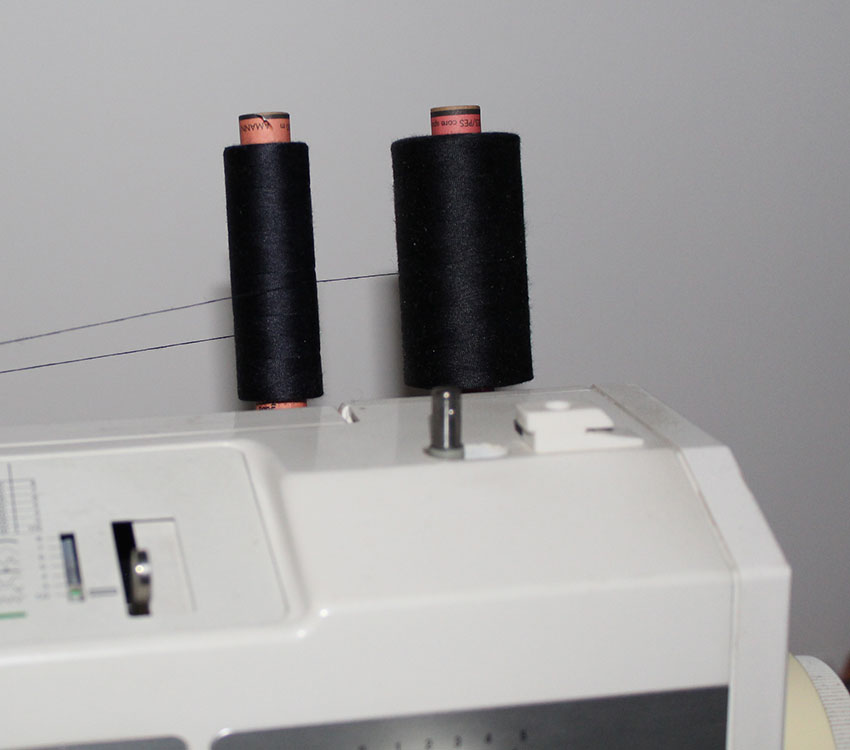 Two top threads on a sewing machine.