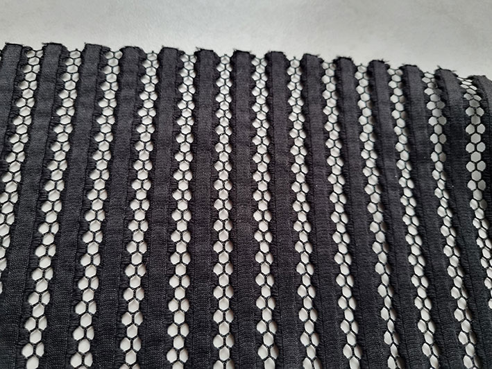 Black netting with stripes.