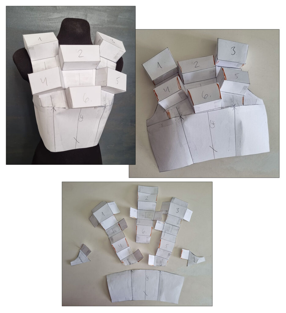 The finished pattern on the mannequin, drawing style lines and separating the pieces to flatten them.