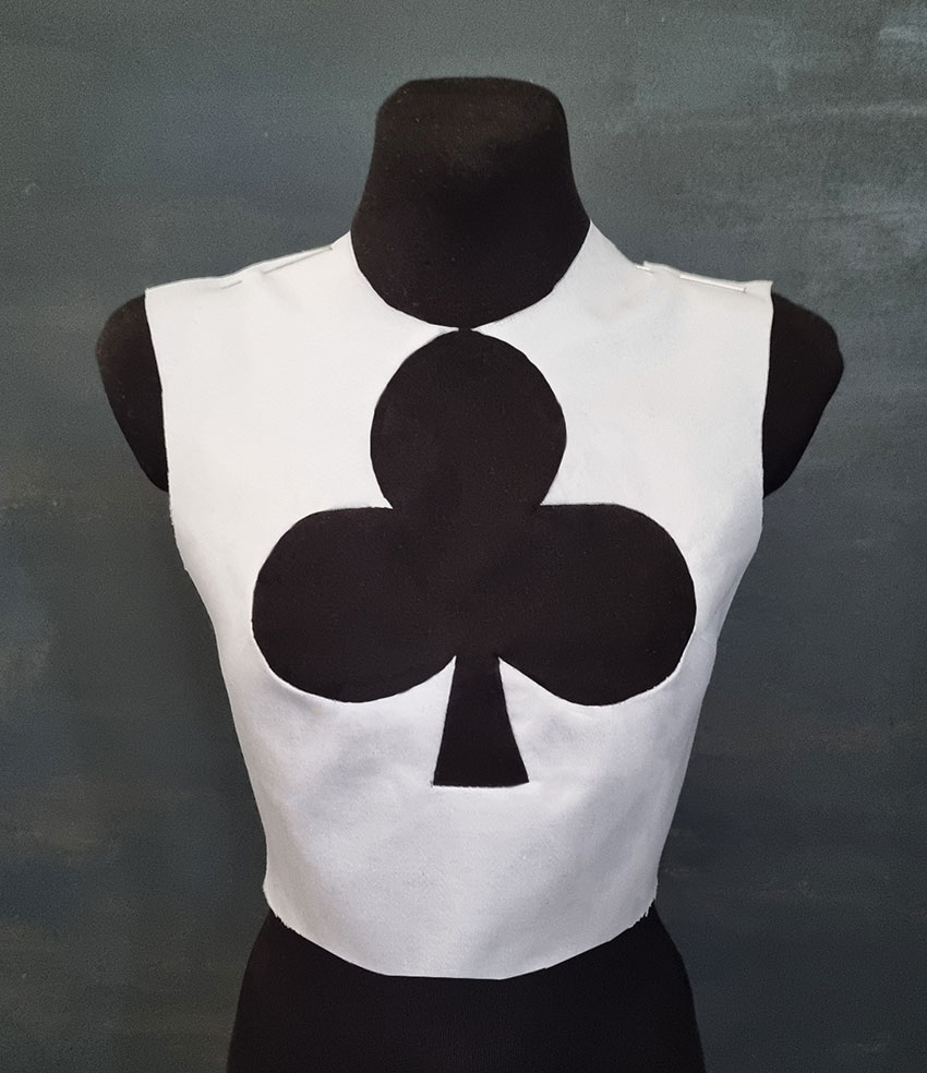 White top with a black club shape in the front.