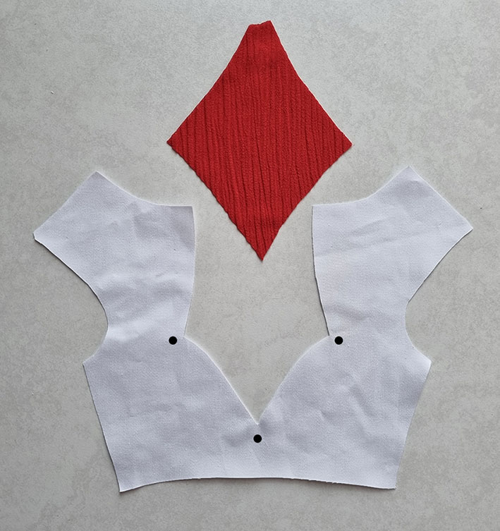 The bodice and the diamond shape cut.