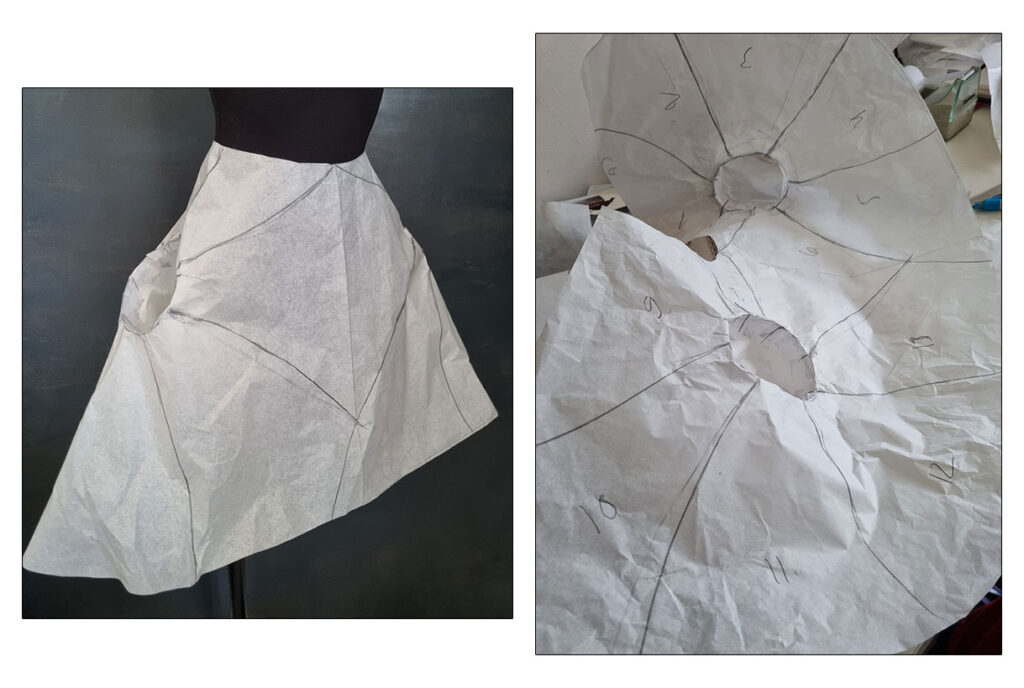 The skirt pattern on the mannequin and drawing the style lines.