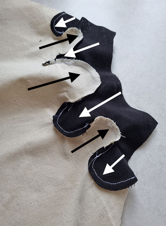 Ironing the seam allowances outwards.