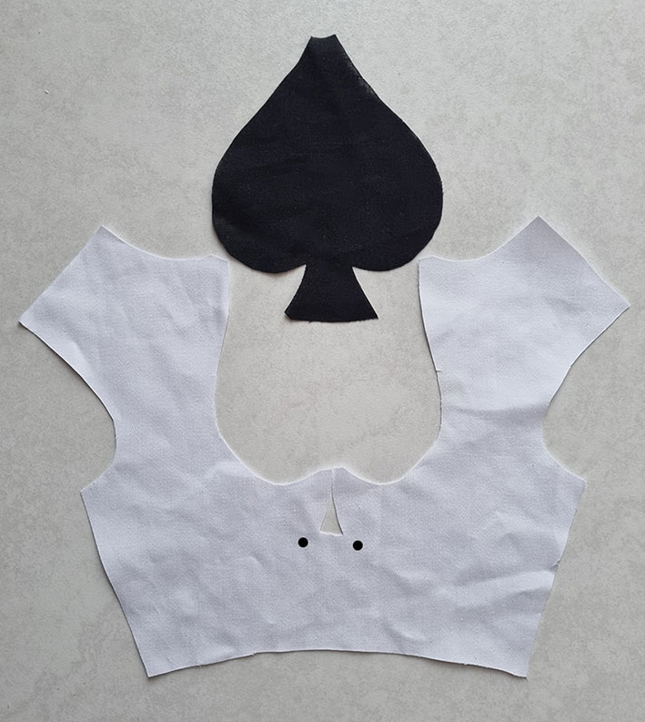 The bodice and the spade shape cut.