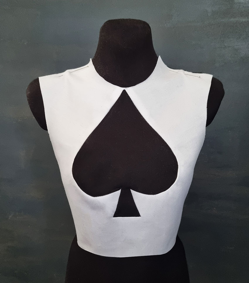 White top with a black spade shape in the front.