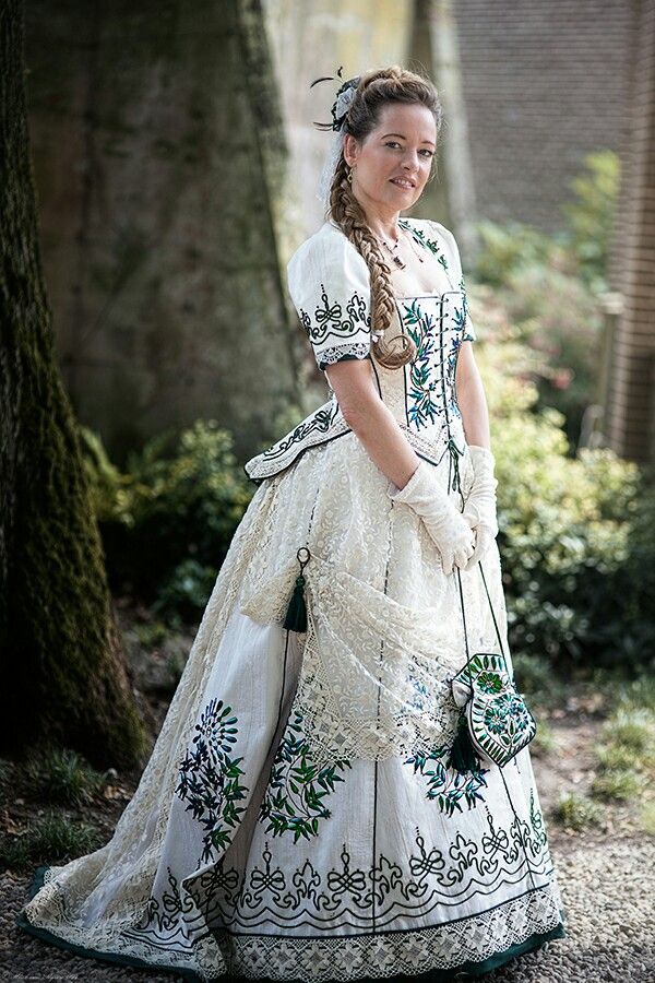Angela wearing a white, embroidered beetle wing dress. Photo by Henk van Rijssen.
