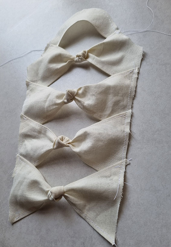 The knot sleeve prepared with all the sections stitched together but the inseam still open.