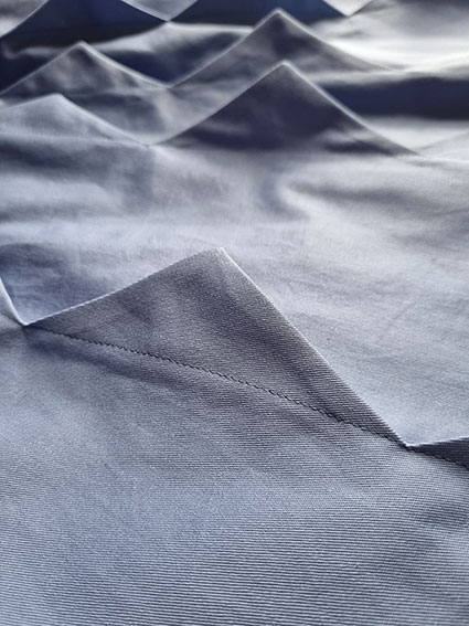 The completed contoured tucks with triangular shapes.