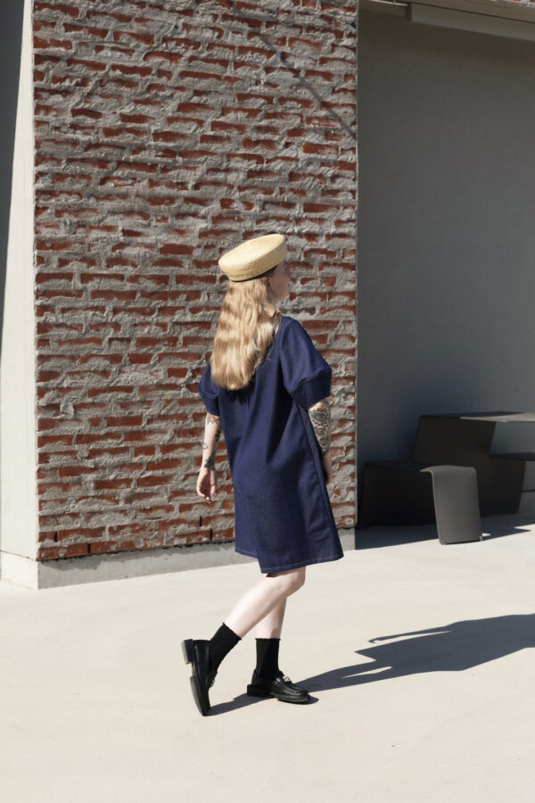 Model wearing the Callisto dress made in denim. Back view. Photo by Laura Oja.