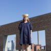 Model wearing the Callisto dress made in denim. Front view. Photo by Laura Oja.